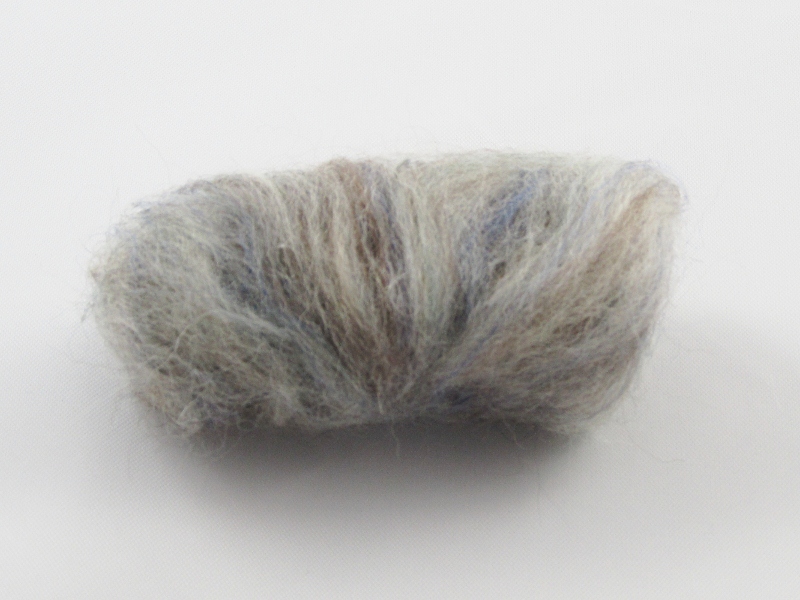 Take a large strip of agate wool and roll it into a sausage shape. Holding it against the foam pad, poke the body in a straight up and down motion with a 38-gauge felting needle. Leave one end of the body unfelted for attaching the head. You know it is ready when it feels spongy when you press it with your finger.