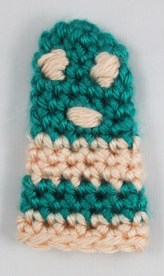 Embroider eyes on your luchador